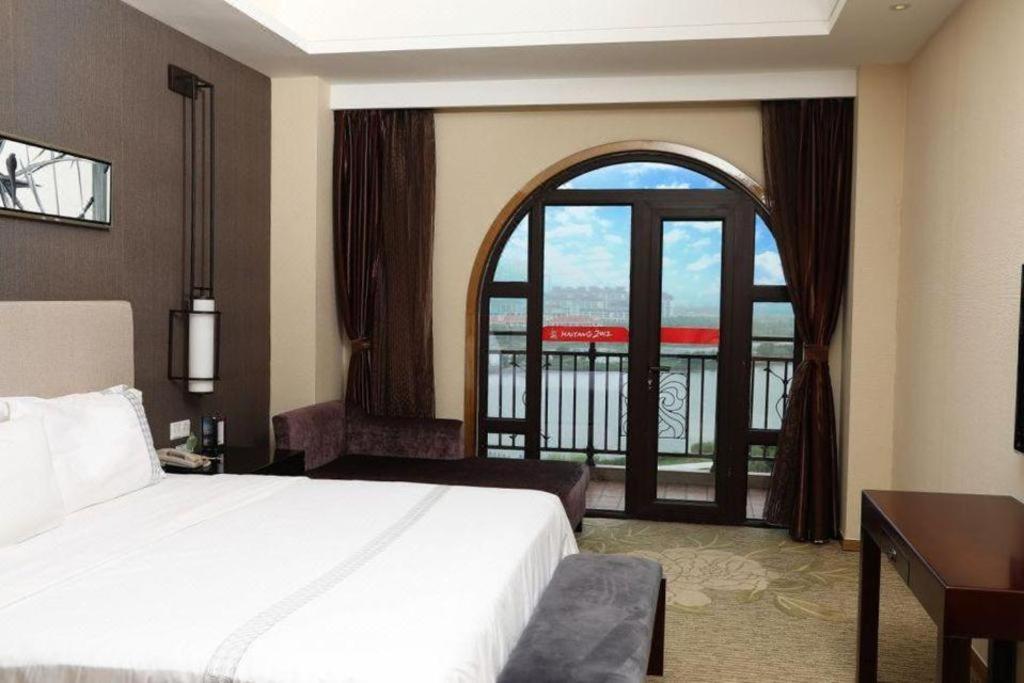Haiyang Shenglong Jianguo Hotel Fengcheng  Bagian luar foto